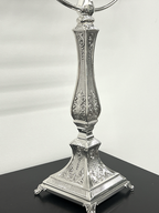 Silver Menorah with eight candles on a white background