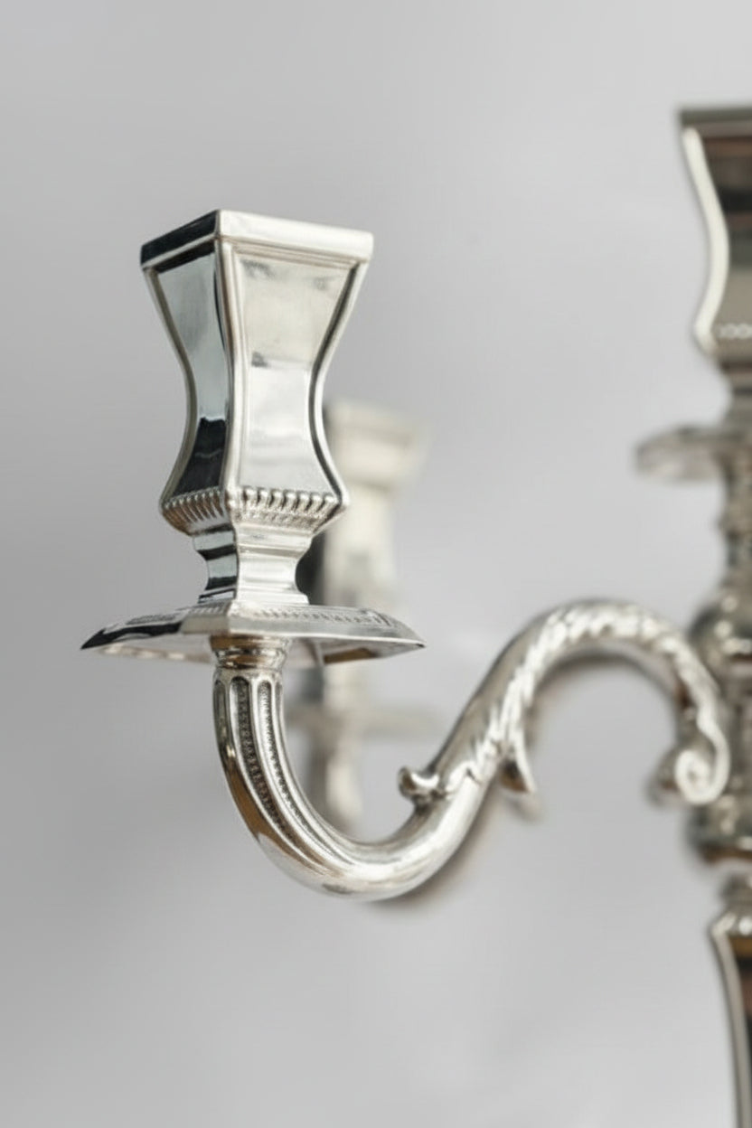 hadad bros Silver candelabra on a white background