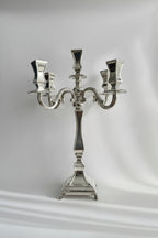 hadad bros Silver candelabra on a white background