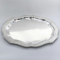 Silver decorative tray on a light gray background