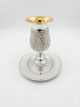 Silver kiddush cup with gold top and matchng tray on a white background