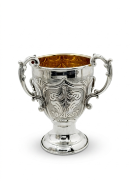 Decorative silver bowl and natla set with intricate designs on a white background
