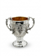 Decorative silver bowl and natla set with intricate designs on a white background