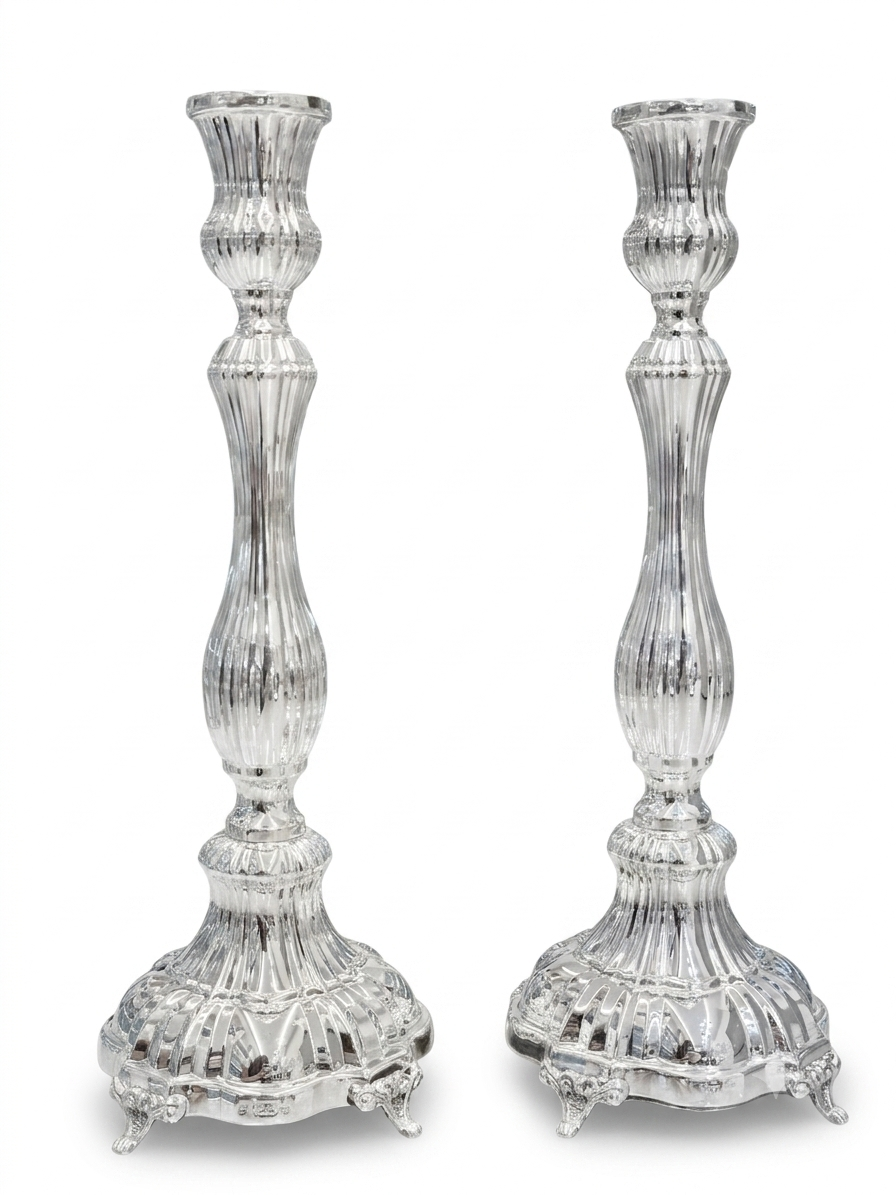Two silver candlesticks on a white background