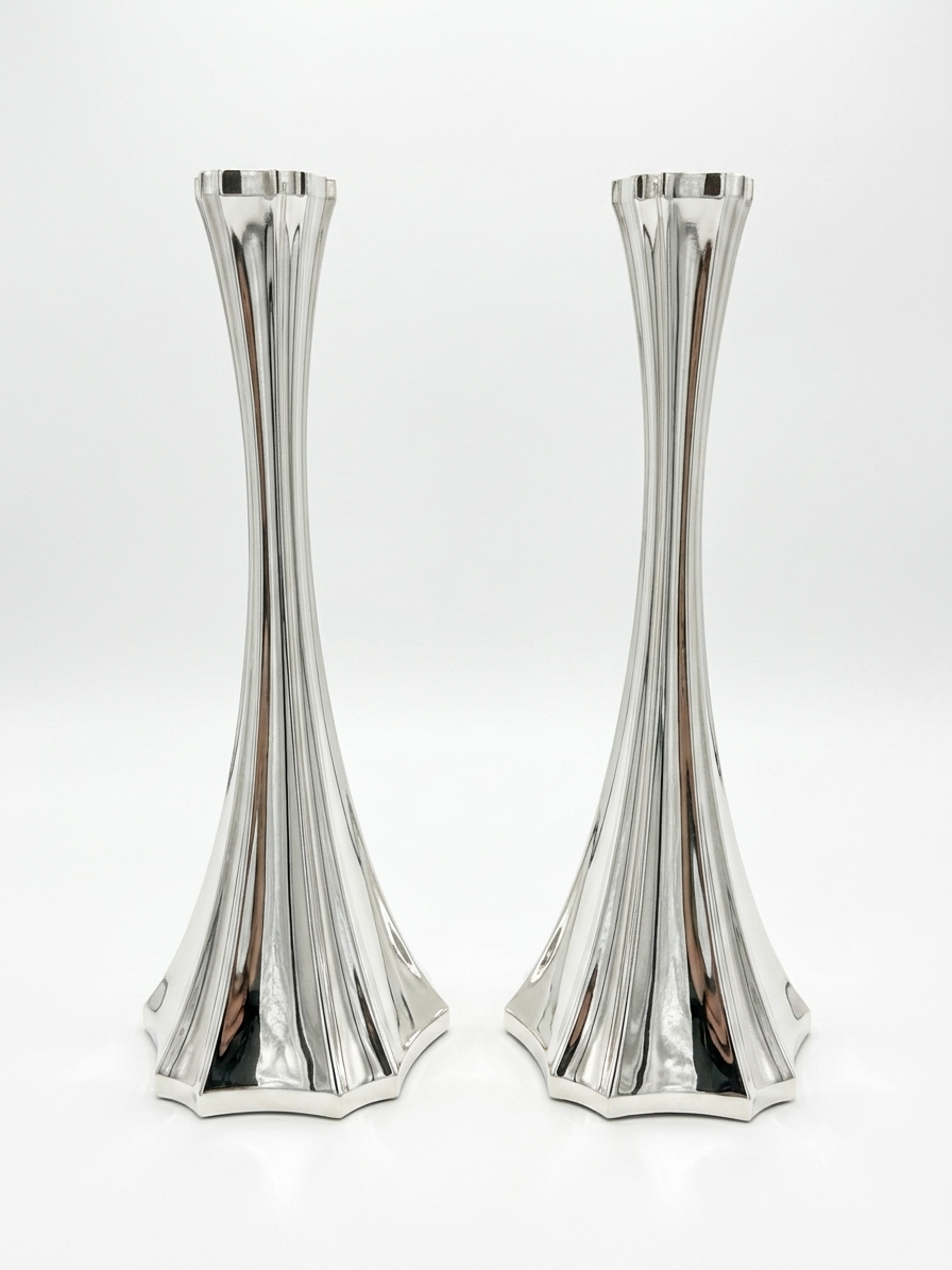 Two silver 925 candlesticks on a white background
