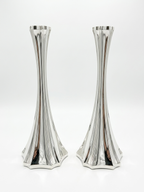 Two silver 925 candlesticks on a white background