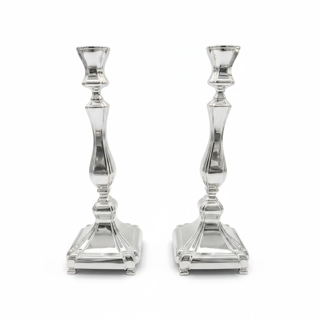 Two sterling silver 925 candle holders on a white background