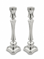 Two silver candlesticks on a white background