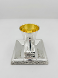 Hadad bros A silver Kiddush cup with a gold interior, set on a matching square silver tray with a decorative Jerusalem cityscape border