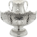 Decorative silver bowl and natla set with intricate designs on a white background