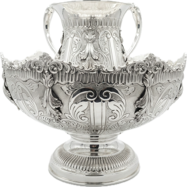 Decorative silver bowl and natla set with intricate designs on a white background