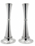 Two silver candle holders with beaded detailing on a white background
