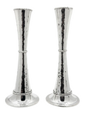 Pair of silver candlesticks holders on a white background