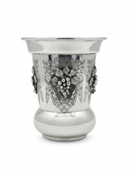 Silver kiddush cup with gold interior on a white background