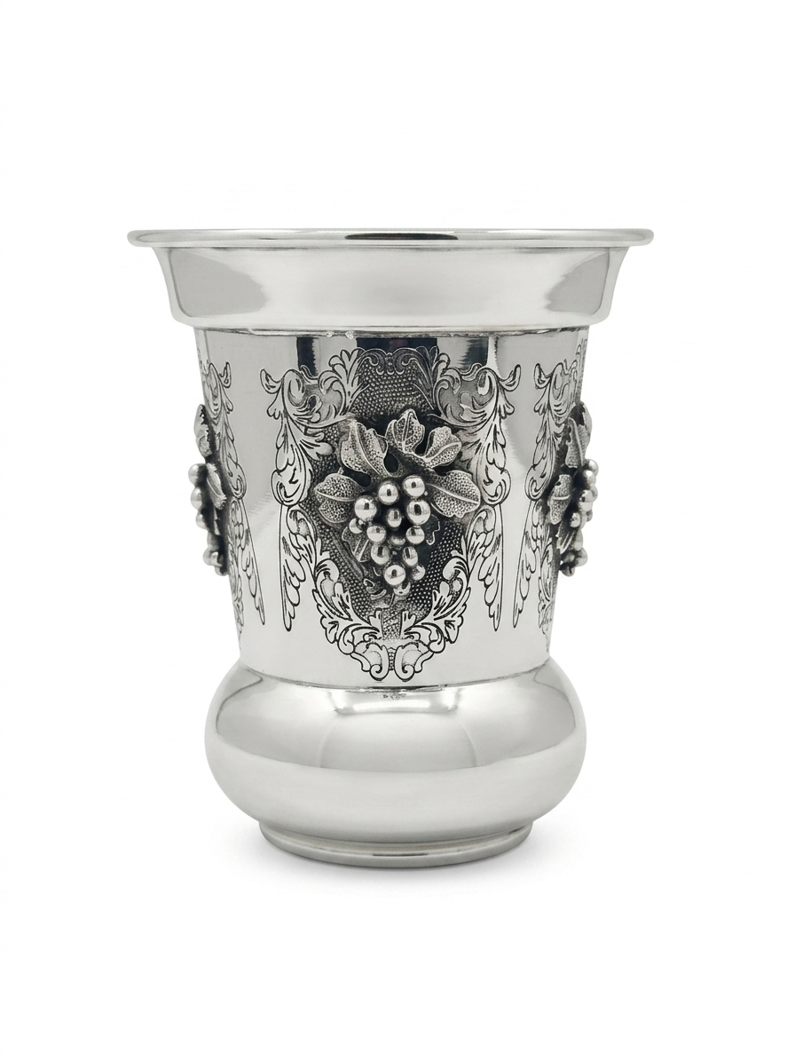Silver kiddush cup with gold interior on a white background
