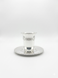 Silver cup and saucer set on a white background