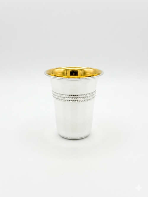 Silver cup with gold interior on a white background