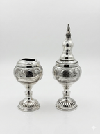 Havdala set with intricate designs on a white background