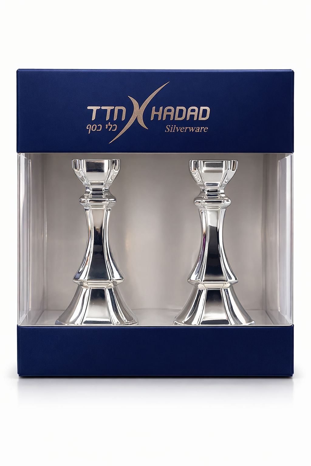 Two silver candlesticks in a TTN Hadad branded box on a white background
