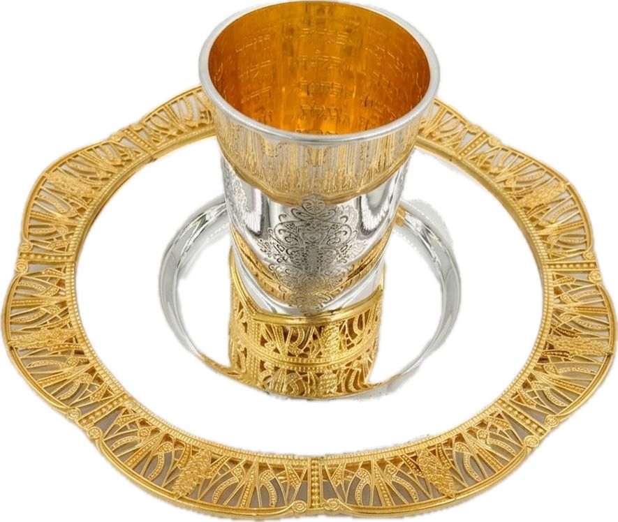 Silver and gold kiddush set on a white background
