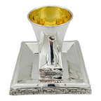 Hadad bros A silver Kiddush cup with a gold interior, set on a matching square silver tray with a decorative Jerusalem cityscape border